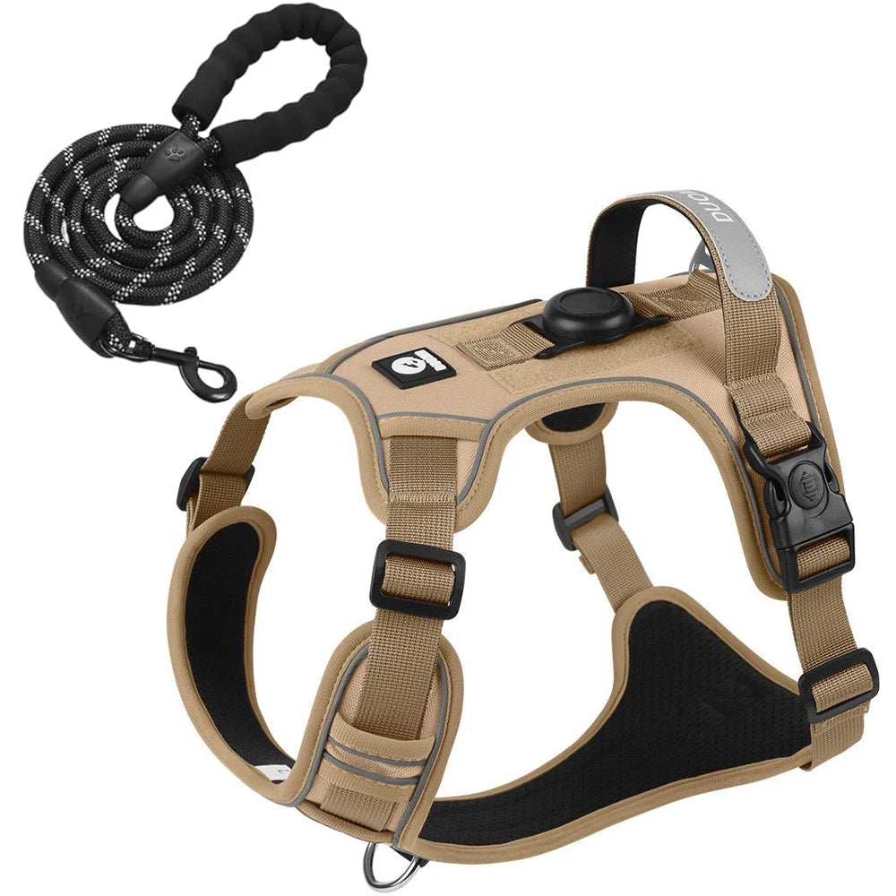 Tan dog harness with black accents and a black leash on a white background
