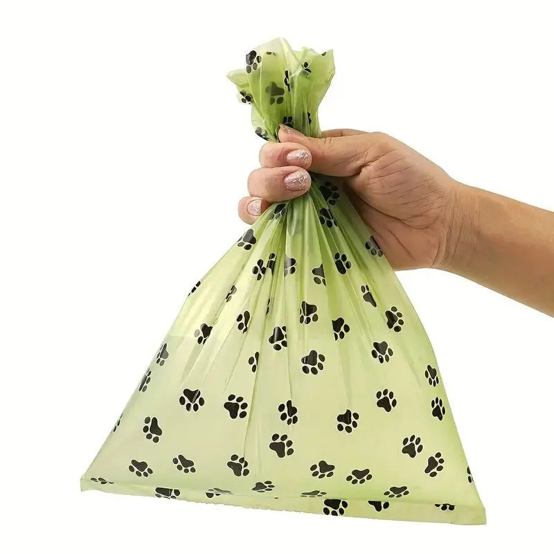 Used dog poop bag tied shut leakproof and strong grip