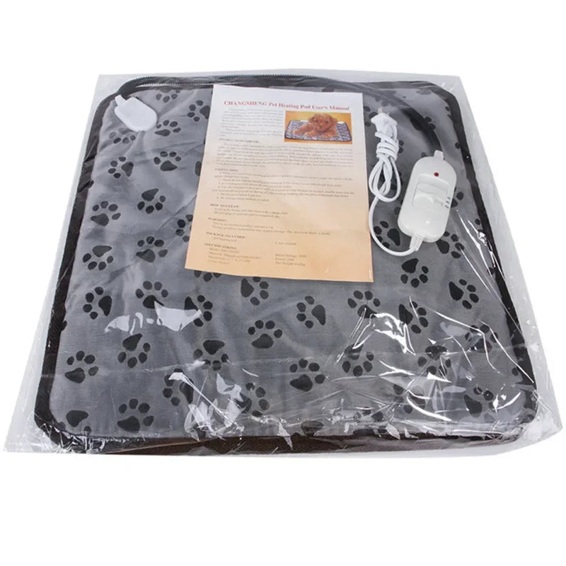Packaged heated pet mat with temperature control and safety manual