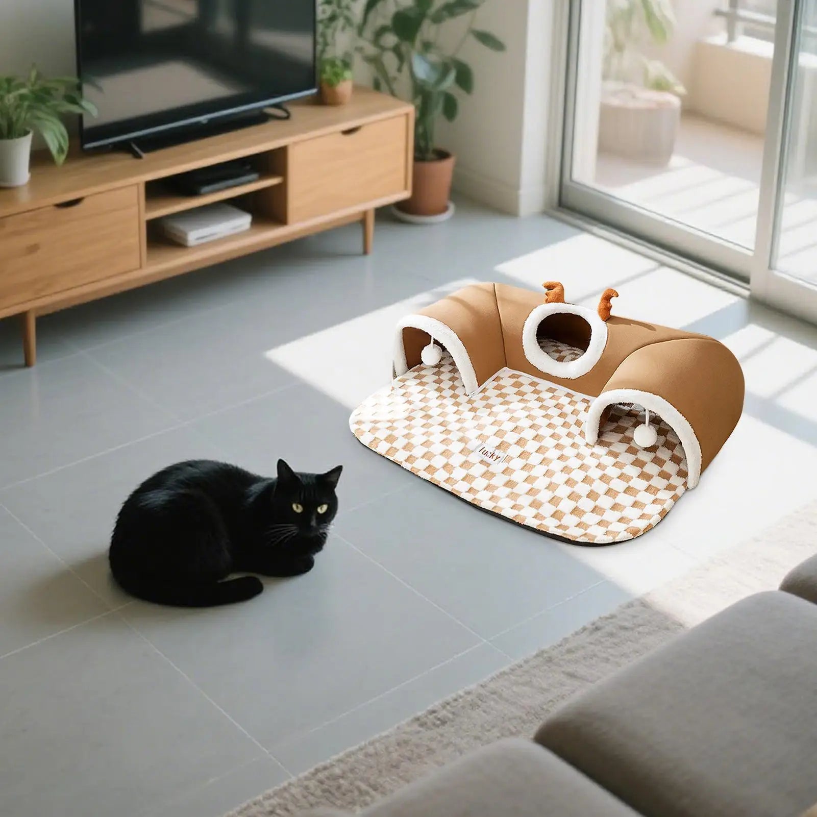 Cozy indoor cat tunnel bed with plush mat for winter comfort